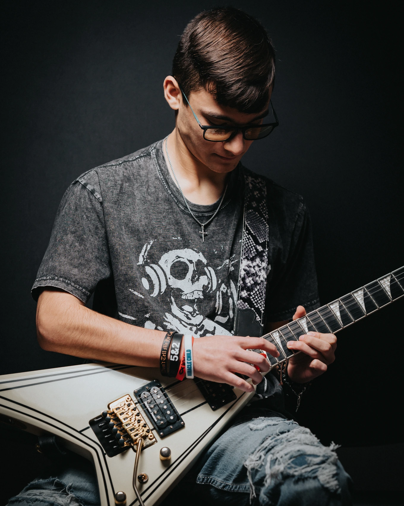 A BLE guitar student playing an electric guitar