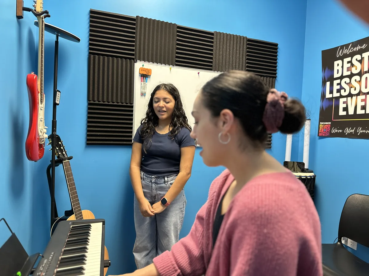 Musicians working on a song at the Friendswood BLE studio
